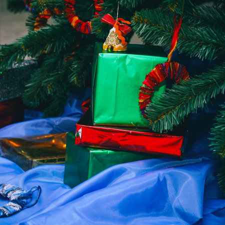 Christmas and New Year gifts in beautiful boxes under the Christmas treeの写真素材