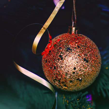 Christmas balls on the Christmas tree branch. Magic lights. Selective focusの写真素材