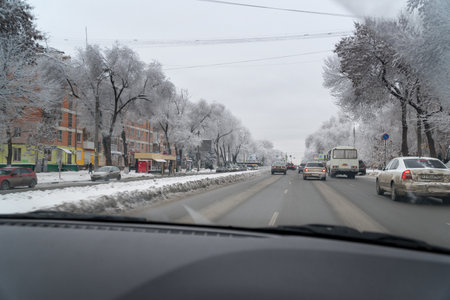 Samara, Russia - December 22, 2018: Cars are driving on the road in a winter city. View from the car windshieldのeditorial素材