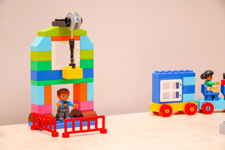 Chapaevsk, Samara region, Russia - January 22, 2022: Lego Minifigures of builders at a construction site from a Lego constructor. Educational games. Selective focusのeditorial素材