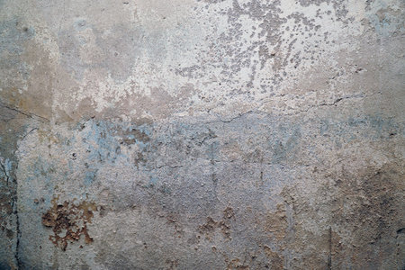 Old dirty cement wall with paint residuesの写真素材