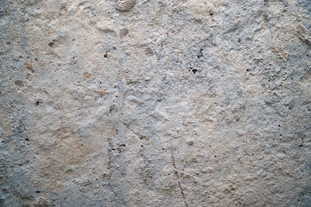 Old dirty cement wall with paint residuesの写真素材