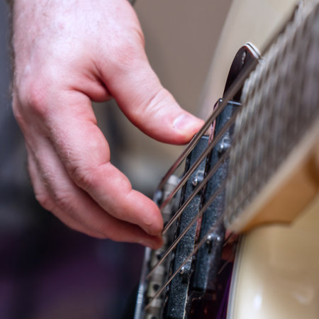 Hands of the guitarists bass . Plays bass guitar. Selective focusの写真素材