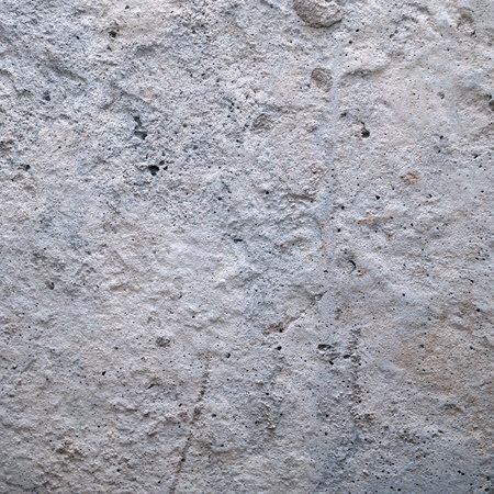 Old dirty cement wall with paint residuesの写真素材