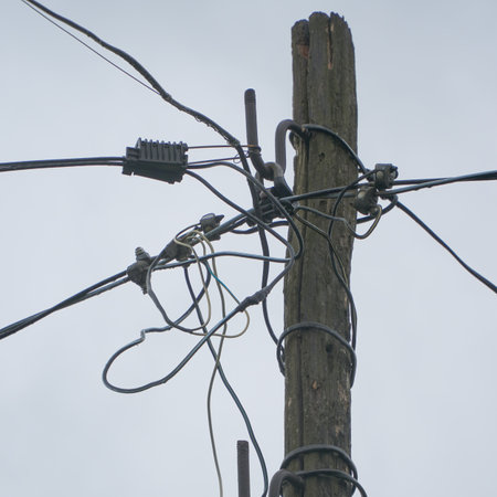 Electric pole with wires. Electric high voltage danger. Electrical pole silhouette.の写真素材