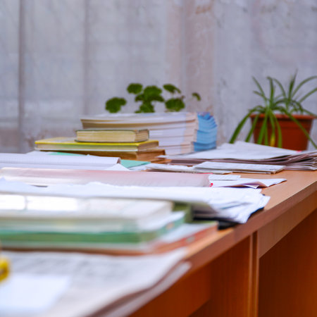 Books and office supplies on the table. Selective focus
