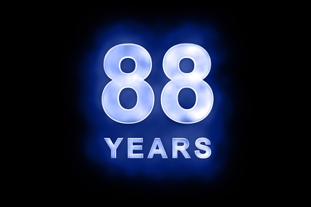88 years text with blue glow on black backgroundの写真素材