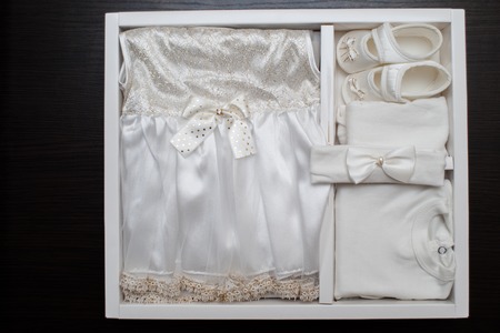 Childrens clothing, dress, shoes, on a dark backgroundの写真素材