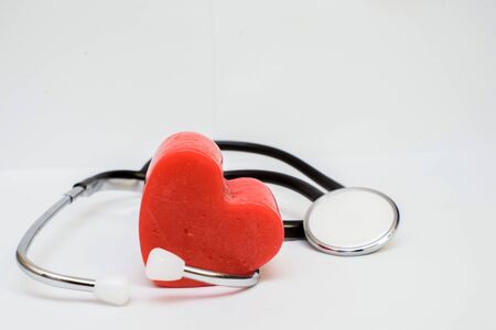 Red heart and a stethoscope on desk cardiac, closeupの写真素材