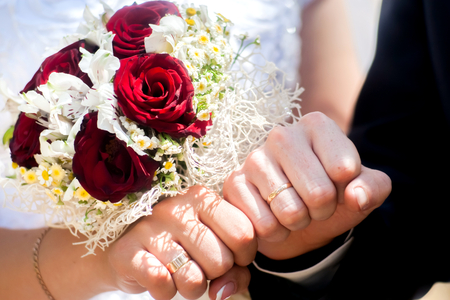 Happy bride and groom on their wedding huggingの写真素材
