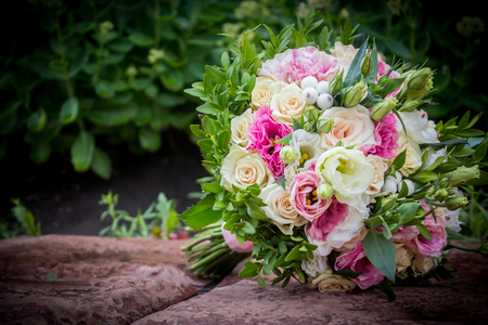 Close-up of grooms hand bouquetの写真素材