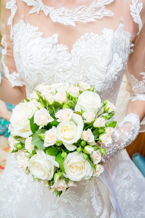 Wedding bouquet in brides handsの写真素材