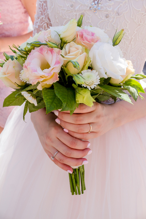 The bride holding a flowerの写真素材