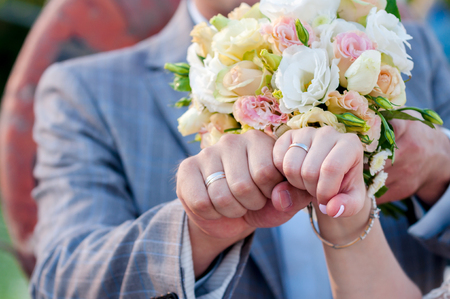 Hands of groom and bride with ringsの写真素材