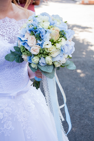 Close-up of bride holding the flowerの写真素材