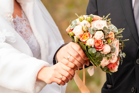 Bride and groom with bouquetの写真素材