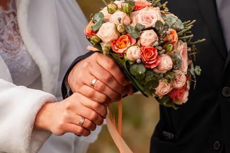 Bride and groom with bouquetの写真素材