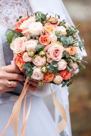 Bride and groom with bouquetの写真素材