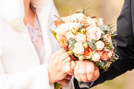 Bride and groom with bouquetの写真素材