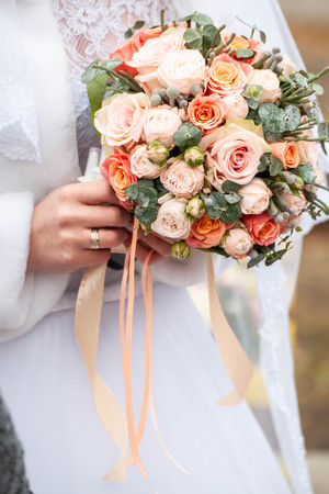 Bride and groom with bouquetの写真素材