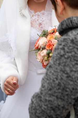 Bride and groom with bouquetの写真素材