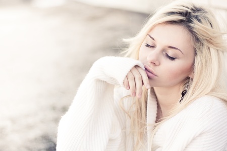 Professional portrait of a beautiful girl dreamingの写真素材