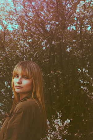 girl outdoor spring portrait with the flowers.の写真素材
