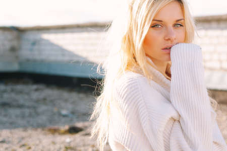 Girl in sweater close-up portrait outdoor. Warm fall.の写真素材