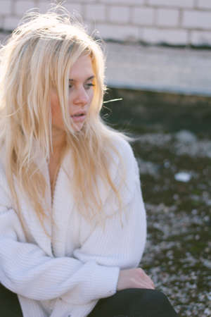 Girl in sweater close-up portrait outdoor. Warm fall.の写真素材