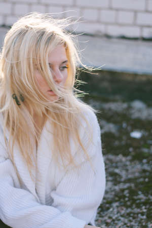 Girl in sweater close-up portrait outdoor. Warm fall.の写真素材