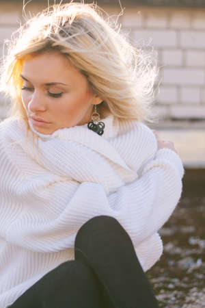 Girl in sweater close-up portrait outdoor. Warm fall.の写真素材