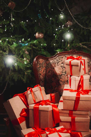 Gifts christmas tree merry on green background. New year party. Christmas tree and giftsの写真素材