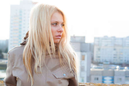 Outdoor portrait of young sensual woman in the hood closeup.の写真素材