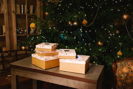 Gifts christmas tree merry on green background. new year party. christmas tree and giftsの写真素材