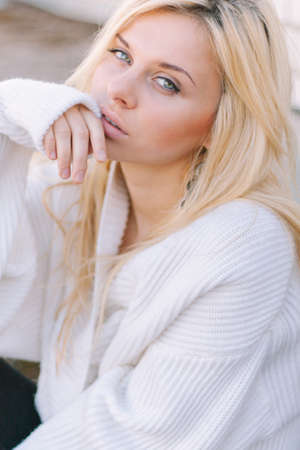 Outdoor portrait of young sensual woman in the hood closeup.の写真素材