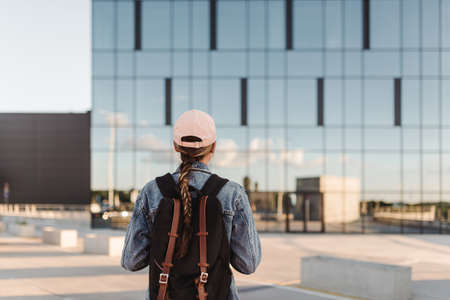 Travelling tourist with her backpack in the downtown and looking directly, Adventure and travel in the concept . Tourism in city.の写真素材