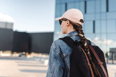 Travelling tourist with her backpack in the downtown and looking directly, Adventure and travel in the concept . Tourism in city.の写真素材