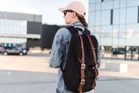 Travelling tourist with her backpack in the downtown and looking directly, Adventure and travel in the concept . Tourism in city.の写真素材