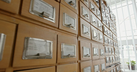 A stylish and vintage filing cabinet with card catalog drawers ideal for any library space