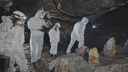 Explorers in a Cave Engaging in Scientific Research and Discovery of New Findings