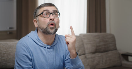 A thoughtful and expressive man deeply engaged in a meaningful and warm conversationの写真素材