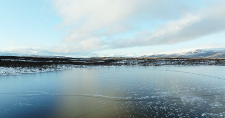 Aerial View of a Frozen Lake in the Scandinavian Wilderness