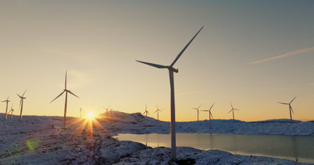 Renewable Energy at Sunset - Wind Turbines in Snowy Norwegian Landscape
