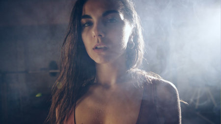 Young adult girl with a towel after training