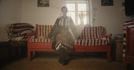 Young Girl in Ukrainian Costume in a Clay House
