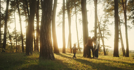 Family Embrace in Sunsets Glow, Child Running Joyfully