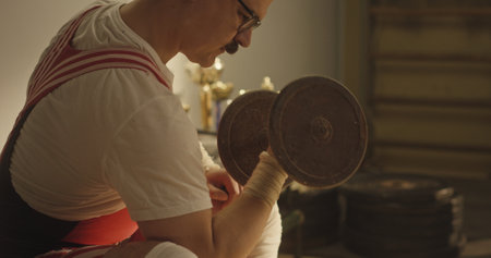 Vintage Gym Workout: Athlete Lifting Dumbbell in Retro Outfit