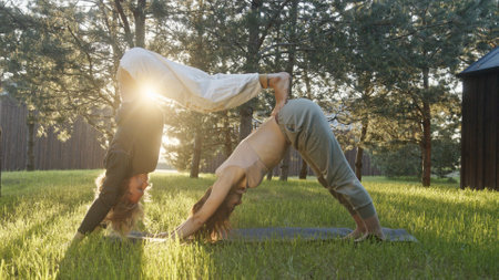 A couple practices yoga in a beautiful natural setting, embracing mindfulness and harmony