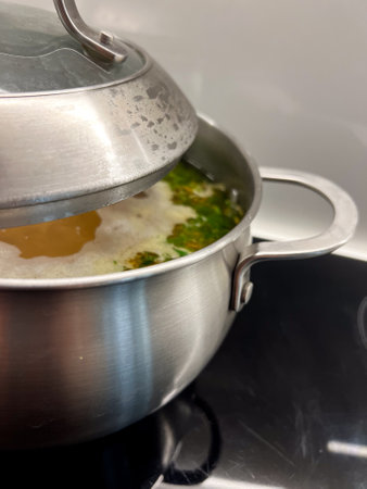 A pot of vegetables is boiling on the stove, filling the air with a delightful aroma