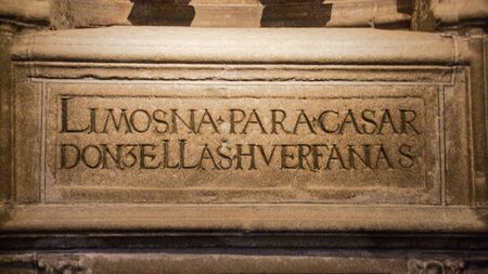 AVILA, SPAIN - APRIL 2016: Sign praying for charity to enable young orphan women to marry, exposed in the cathedral of avila, in spainのeditorial素材